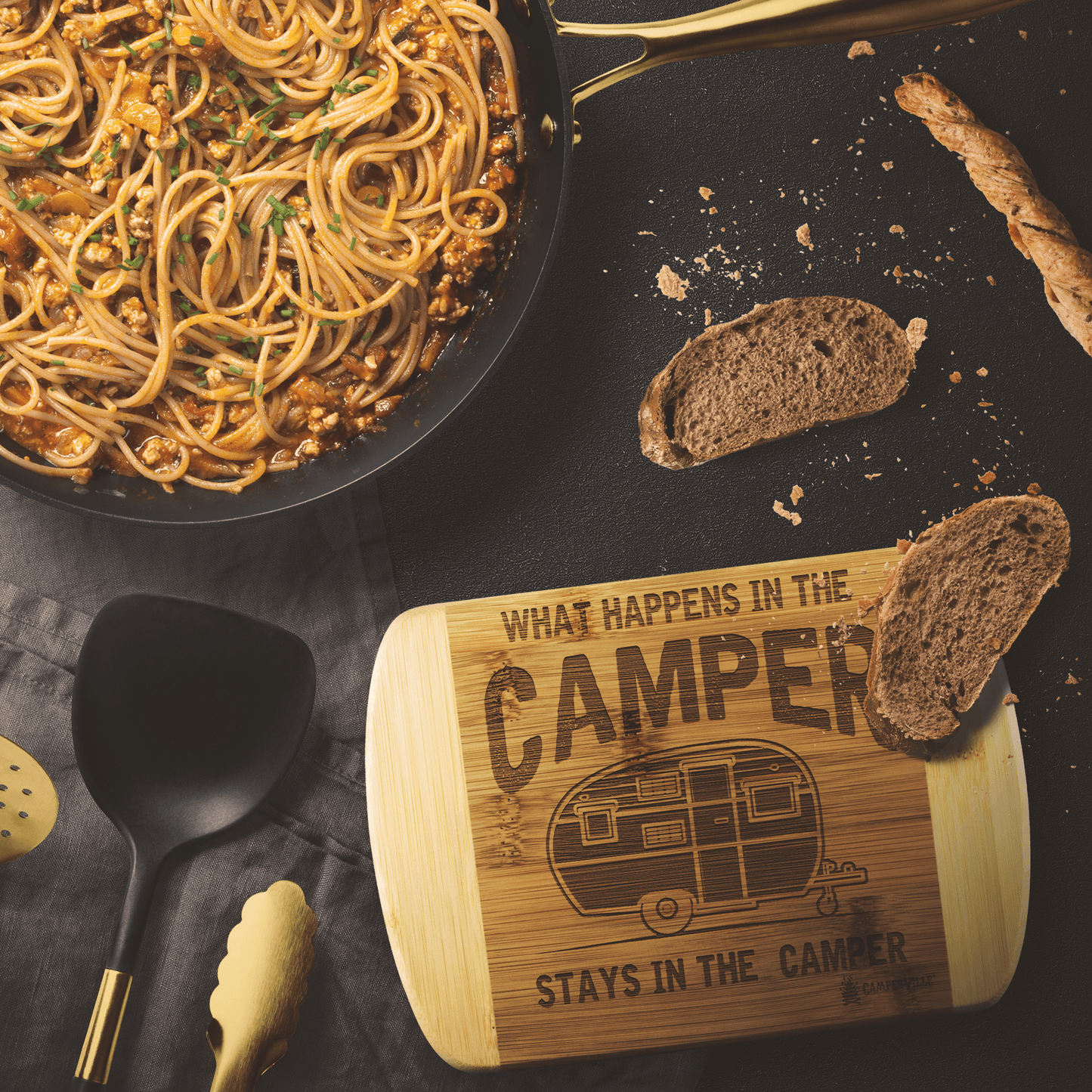 "What Happens In The Camper Stays In The Camper" Cutting Board